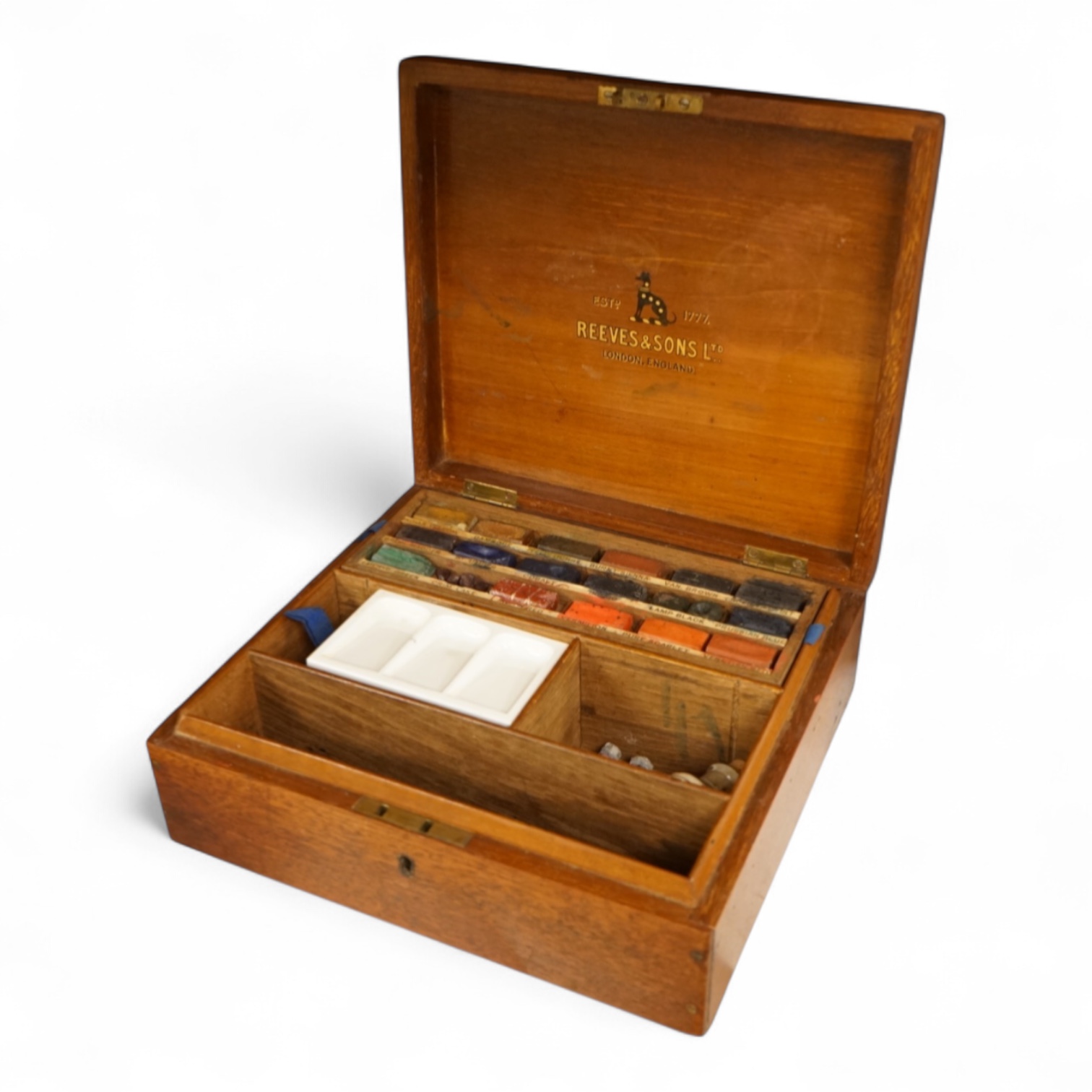 A 20th century Reeves and Sons Ltd artists box with ceramic palette and the remains of paint, 25cm wide